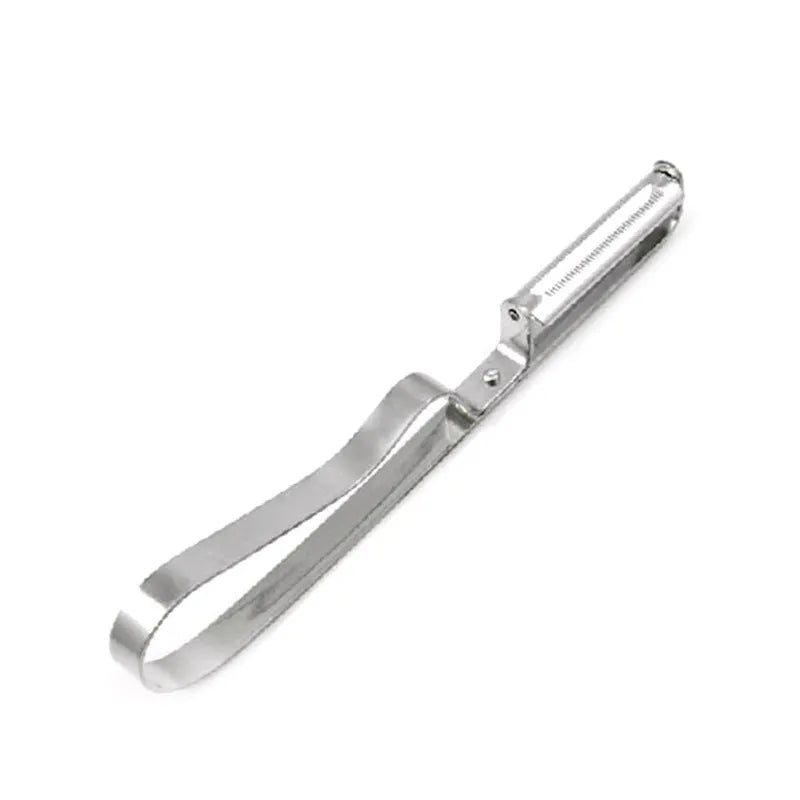 Silver stainless steel fruit and vegetable peeler on a clean kitchen counter