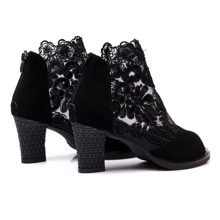 Women's black lace gladiator sandals with square high heel and zip closure, showing flower pattern detail