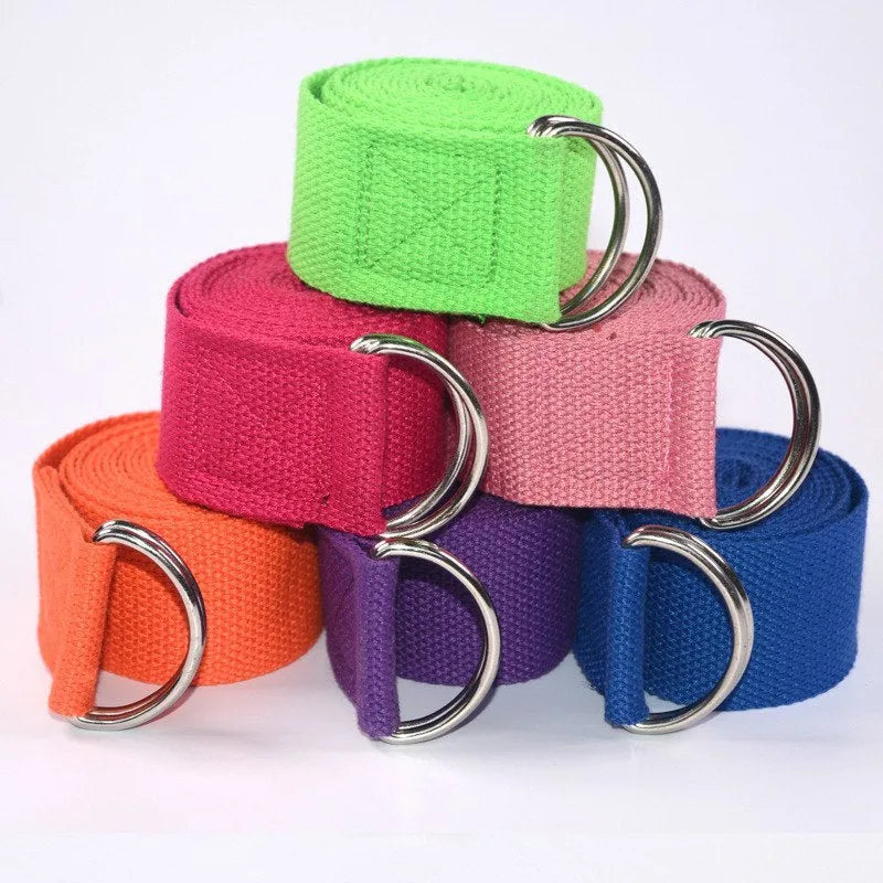 Pure colour EVA yoga brick, thick non-slip mat, and cotton tension band on a floor, in blue, purple, pink, red, black, gray