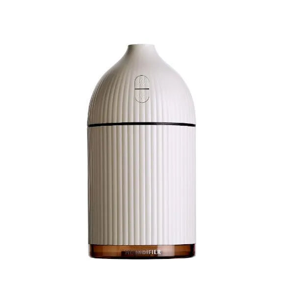 White USB aromatherapy diffuser humidifier with 300ml capacity and LED light on wooden table