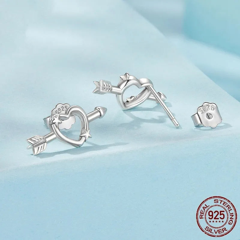 S925 sterling silver mini heart stud earrings with polished finish on white background