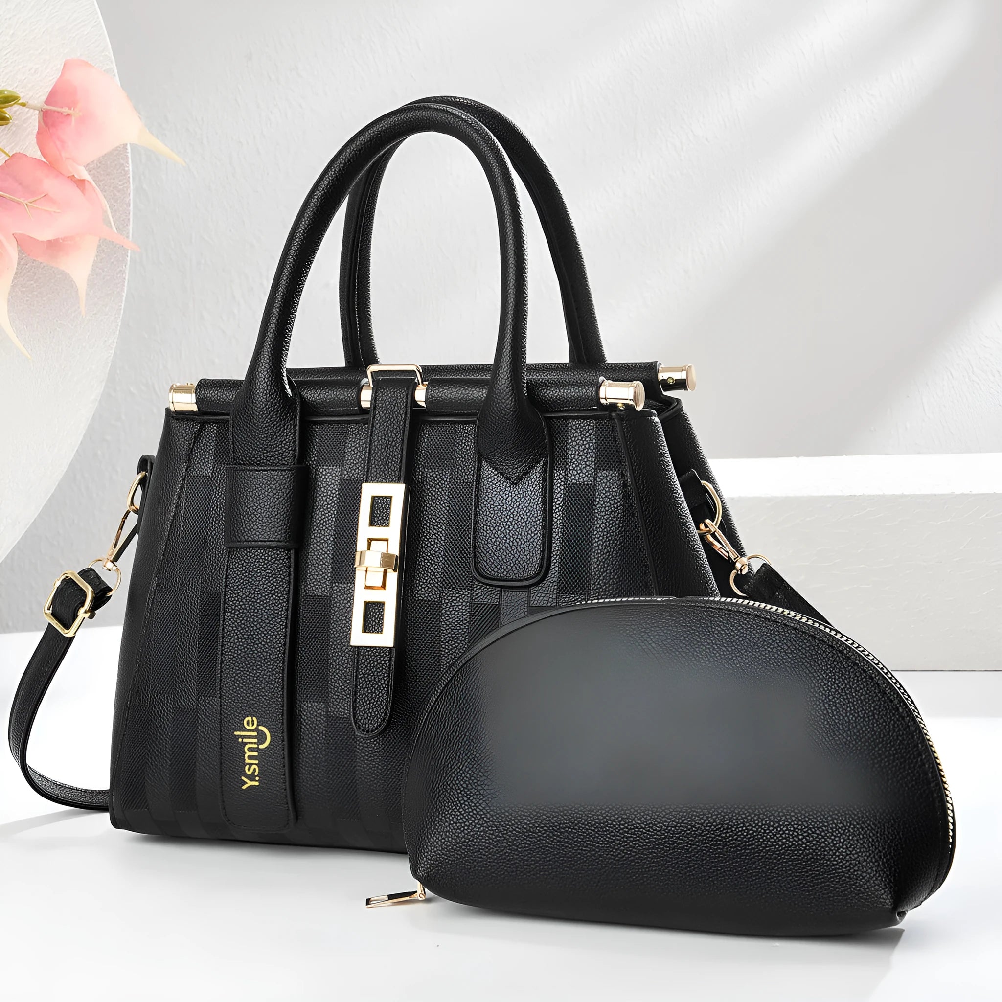 Round black PU handbag with crossbody strap shown alongside light khaki and purplish red colour options