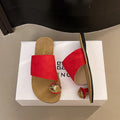 Women's flat bottomed French toe flip flops in solid colours on a light background