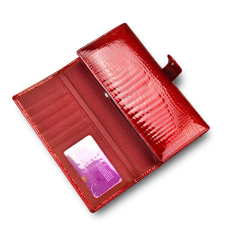 Women's red patent leather coin purse with embossed crocodile pattern texture.