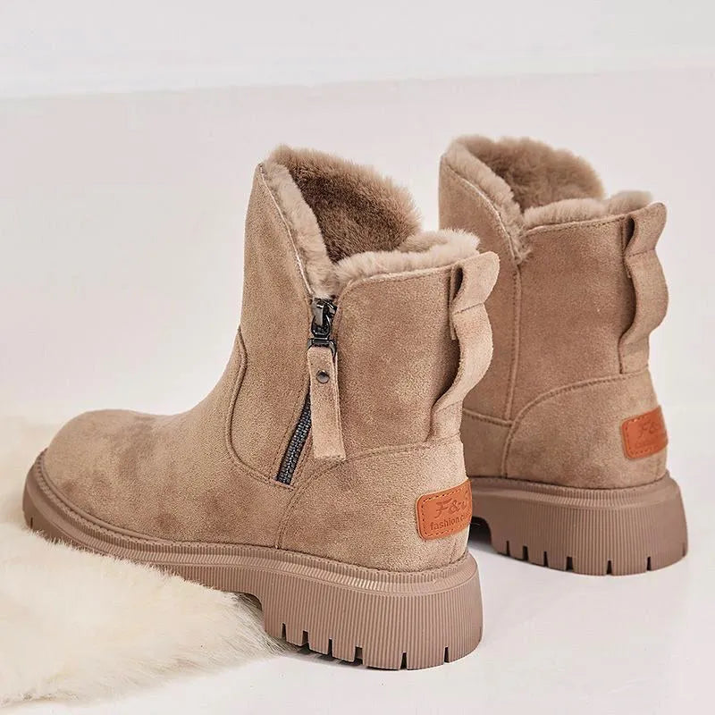 Women's black thick plush high top snow boots with side zipper and round toe on a rubber sole.