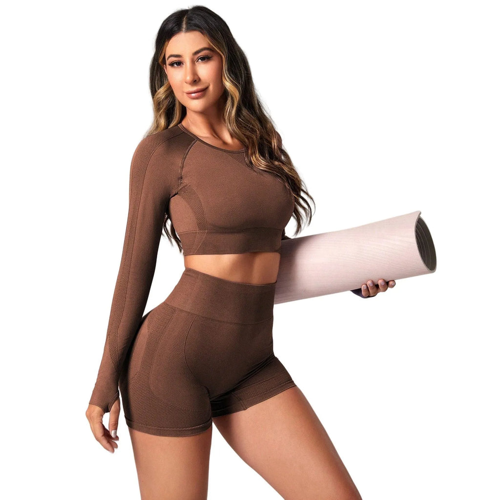 Women's black yoga clothes two-piece set showing long sleeve top and high-waist tight pants.