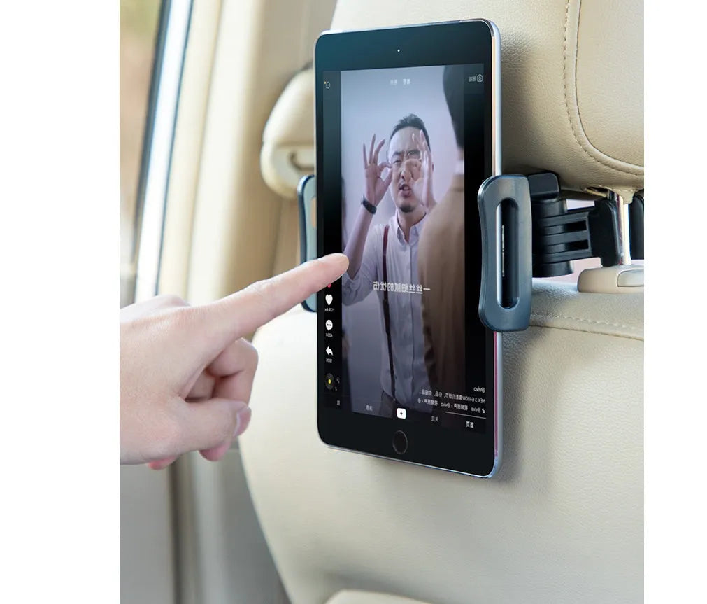 Black universal car phone and tablet holder with adjustable clamp mounted on vehicle rear seat