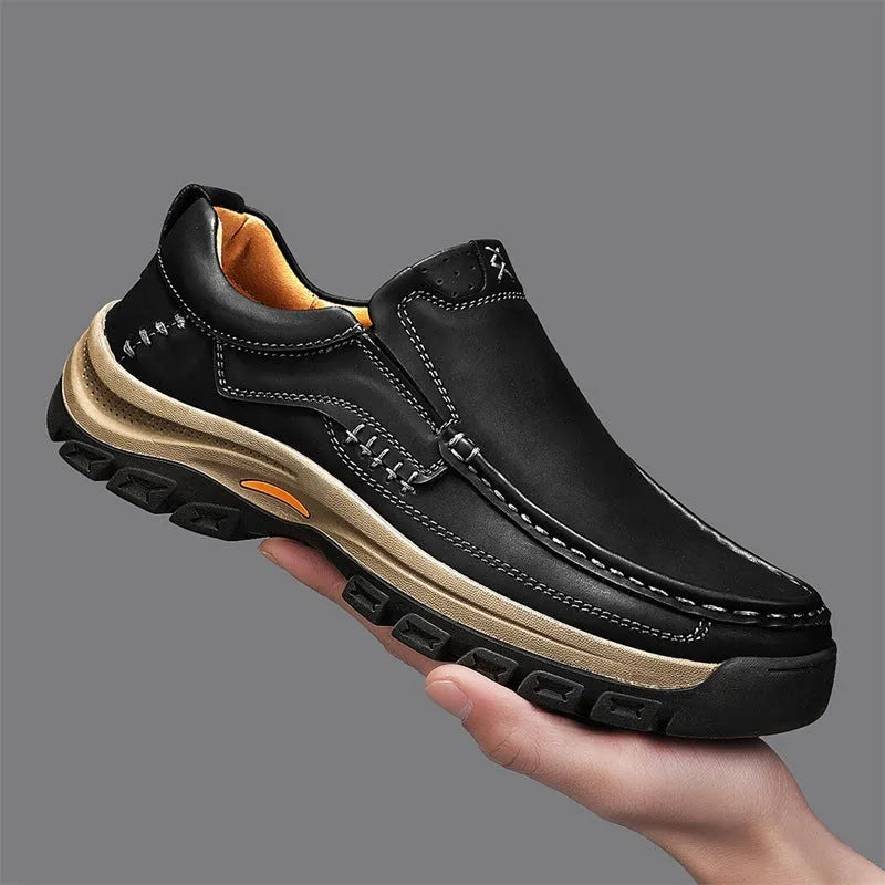 Men's black thick-soled mountaineering boots with round toe and rubber sole.