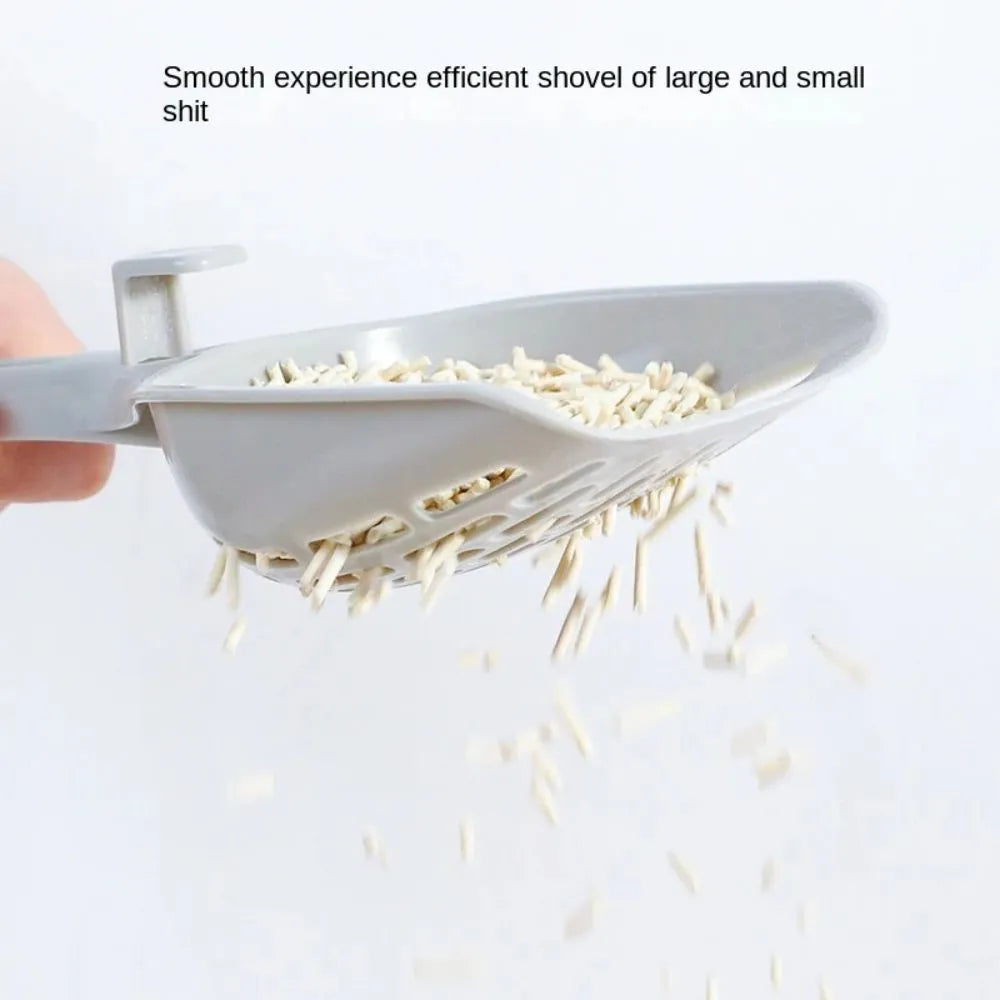 Grey plastic cat litter scoop with matching base for litter box cleaning