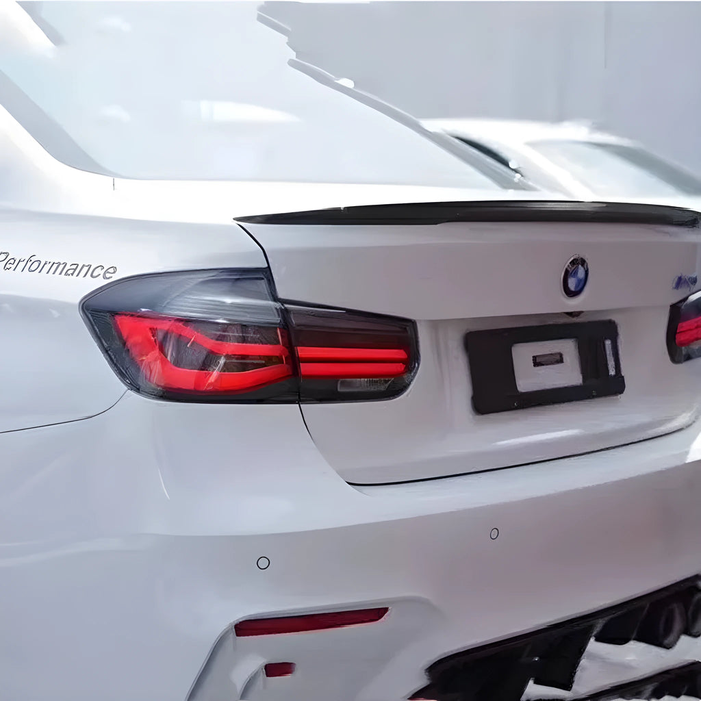 BMW 3 Series modified tail light assembly with streamer steering LED lights in red finish
