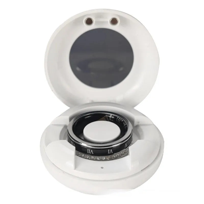 Silver and gold smart rings with blood oxygen monitoring feature on display with charging cable