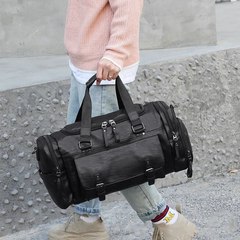 Black large capacity travel bag with separate shoe storage compartment, showing PU fabric exterior.