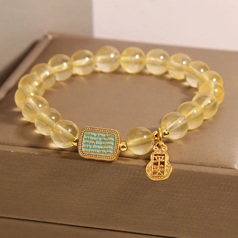 Women's natural yellow crystal bracelet with citrine colour tones and rhinestone decorative elements