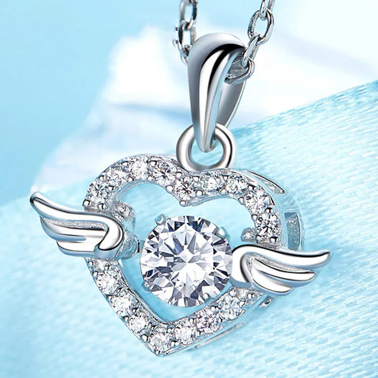 S925 sterling silver angel wings pendant necklace on model – 17mm wing charm with Swiss 4A zirconium diamond, silver colour, electroplated polished finish