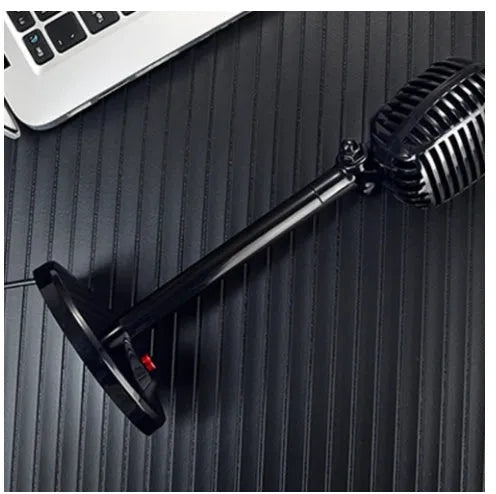 Black USB computer microphone on an adjustable stand with a foam windscreen.