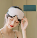 Green portable eye spa massage goggles showing suede shell and soft super fibre interior.