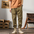 Men's Korean style tapered harem pants in cotton with small leg opening and mid-waist design