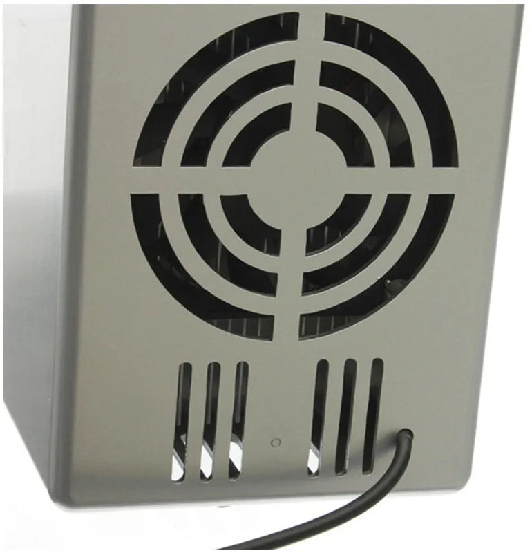 Silver USB mini fridge with LED light, holding two cans, compact size for desk