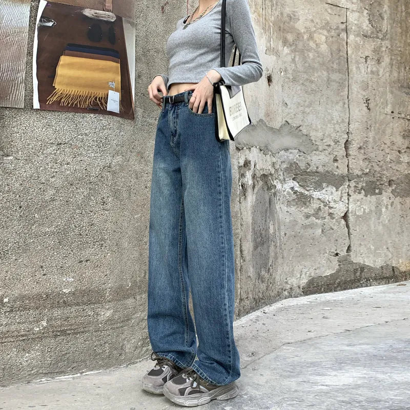Women's high-waisted retro straight jeans in medium blue denim, showing straight leg and high waist silhouette.
