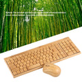 Bamboo wireless keyboard and mouse set on a wooden desk, natural finish, full-size keyboard and compact mouse