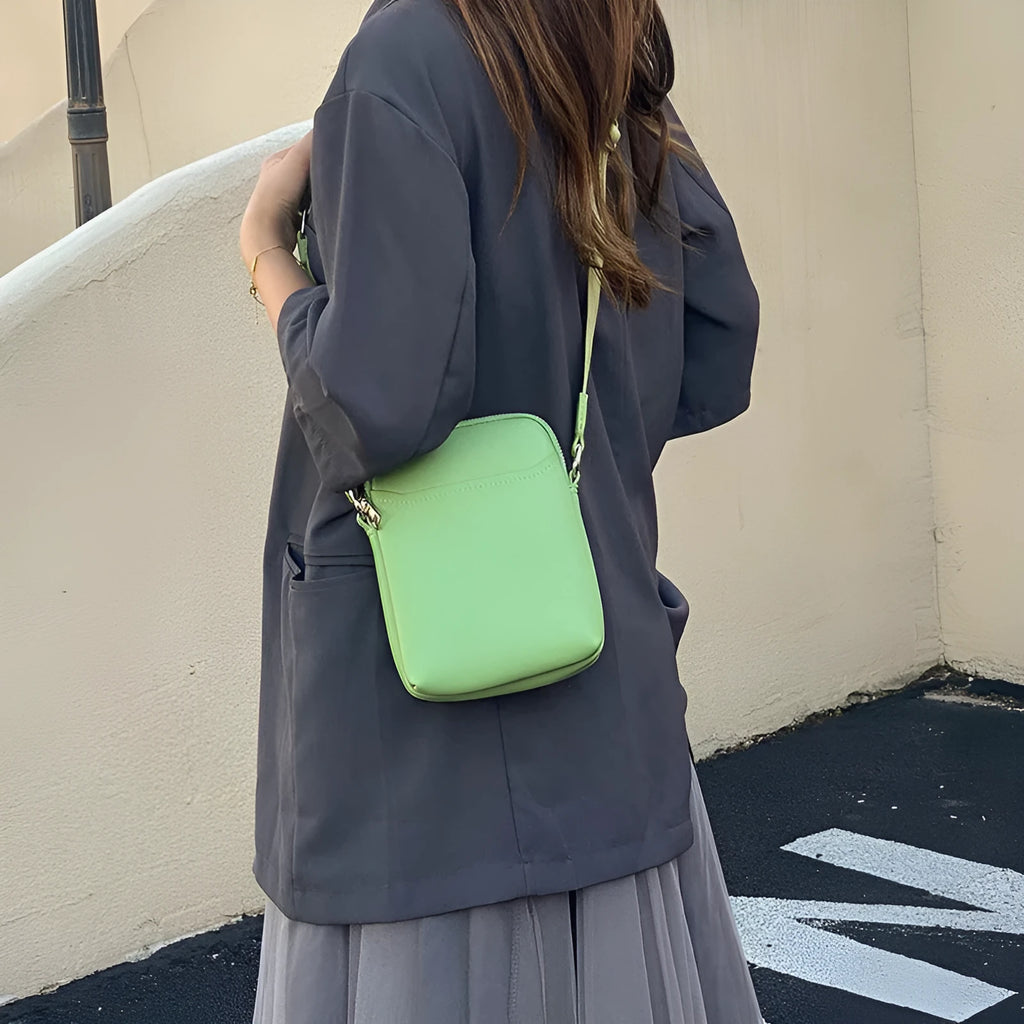 Solid colour PU leather mobile phone crossbody shoulder bag shown in beige.