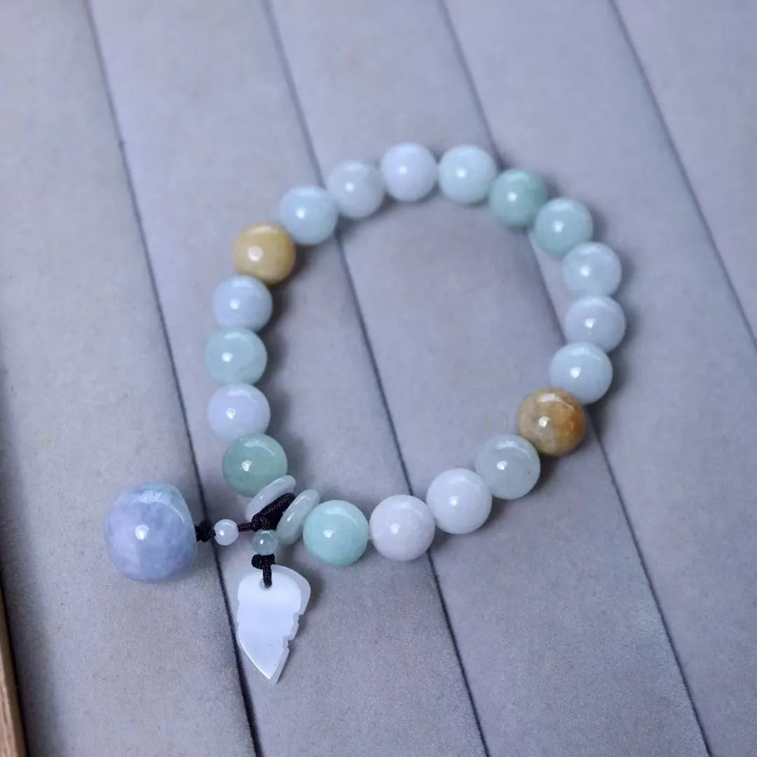 Natural green jade geometric bracelet with an adjustable chain and a hanging Maitreya Buddha charm.