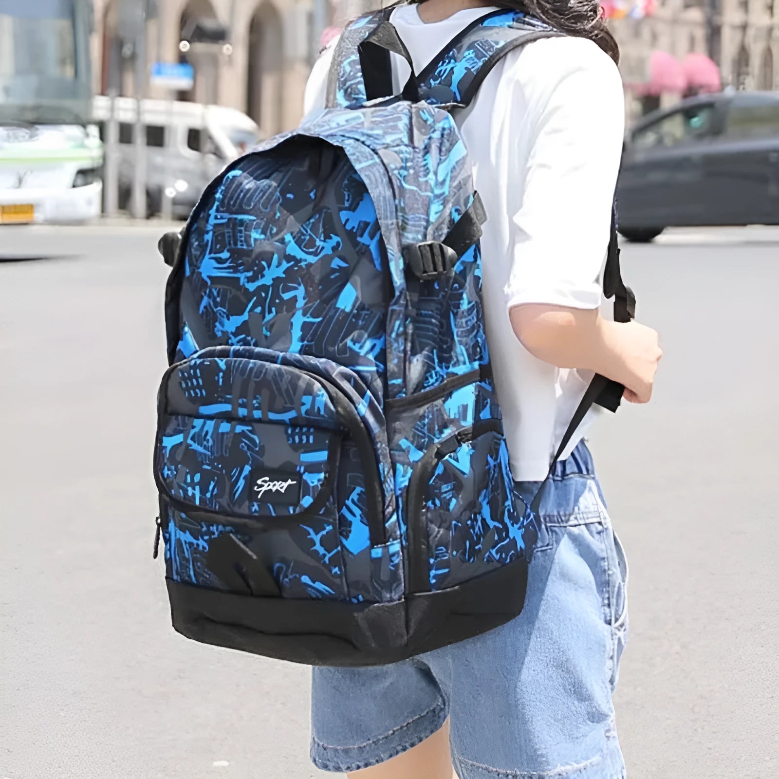 Blue and red large-capacity nylon backpack for school, travel, and outdoor activities.