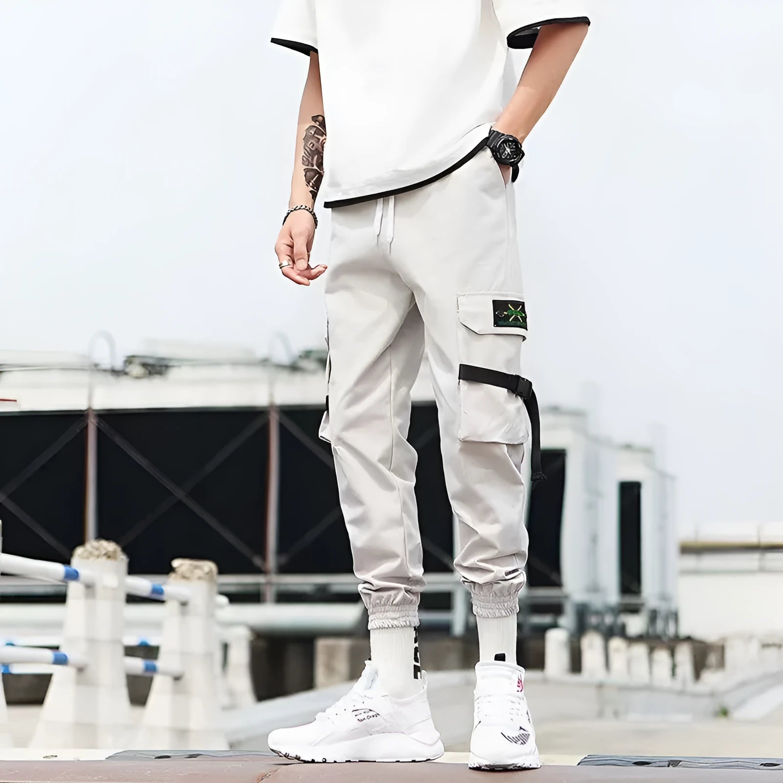 Hip hop jogger pants in khaki cotton fabric with elastic cuffs, shown flat