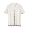 White women's short sleeve cardigan with dark contrast colour lapels on a hanger.