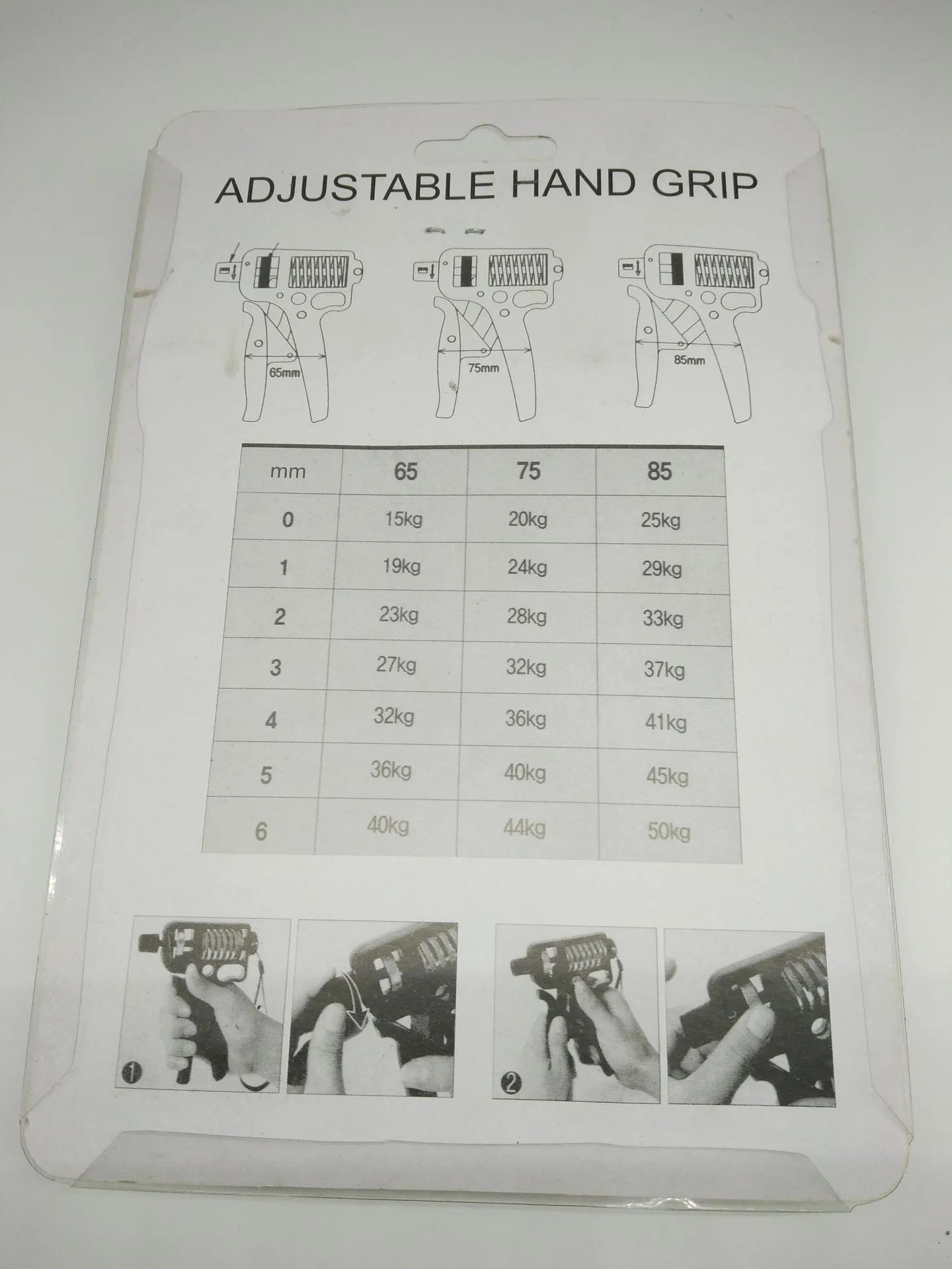 Black adjustable finger trainer grip strength exerciser with ABS and metal construction on a plain background