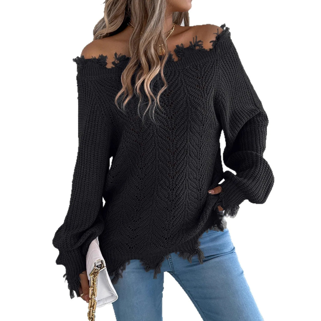 White hollow-out off-the-shoulder long sleeve pullover sweater laid flat.