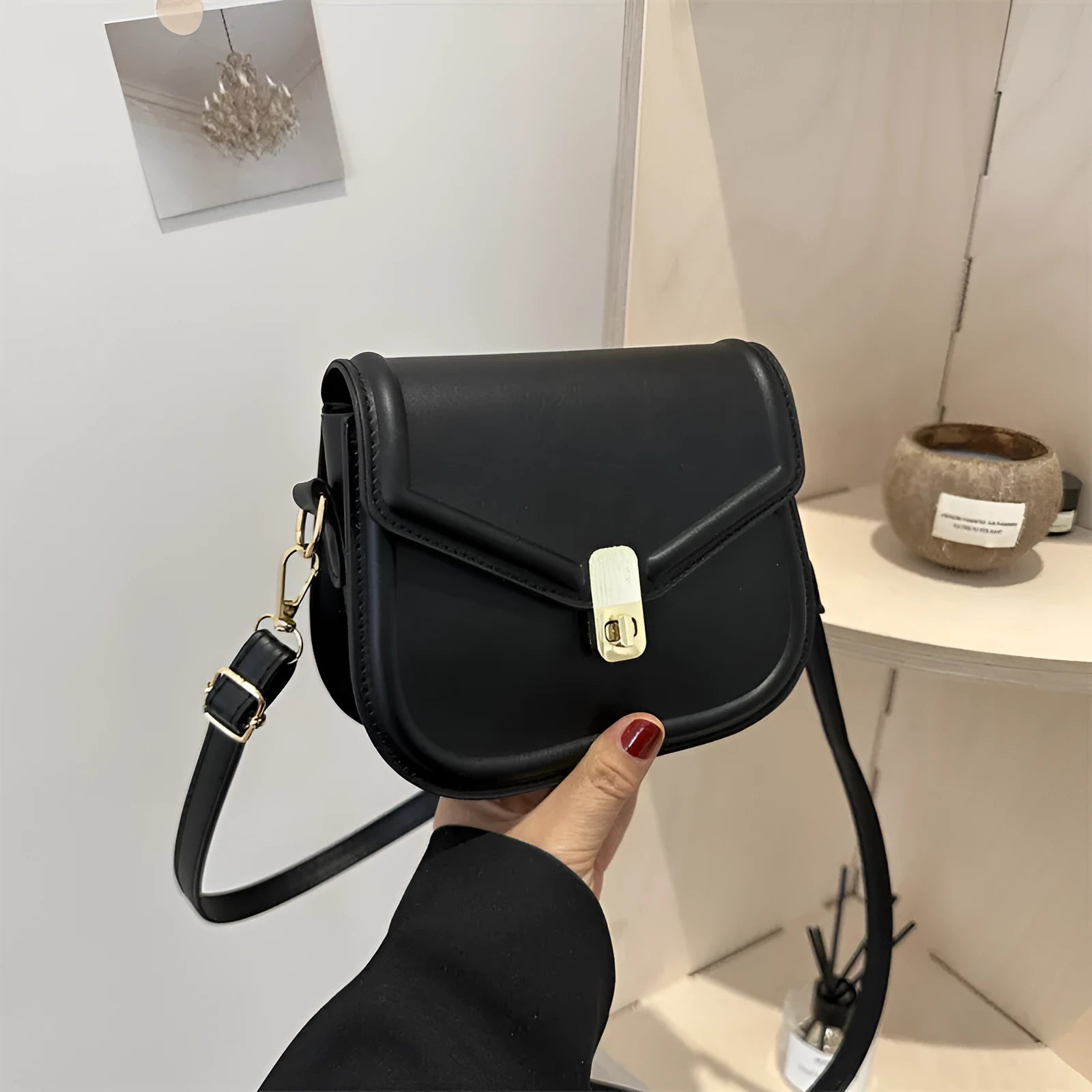 Soft PU leather clamshell messenger bag in horizontal square design shown in available colours.