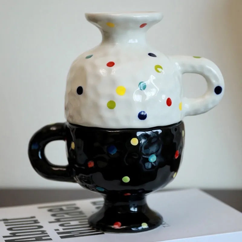 Hand-pinched irregular ceramic mug in solid colour with modern design