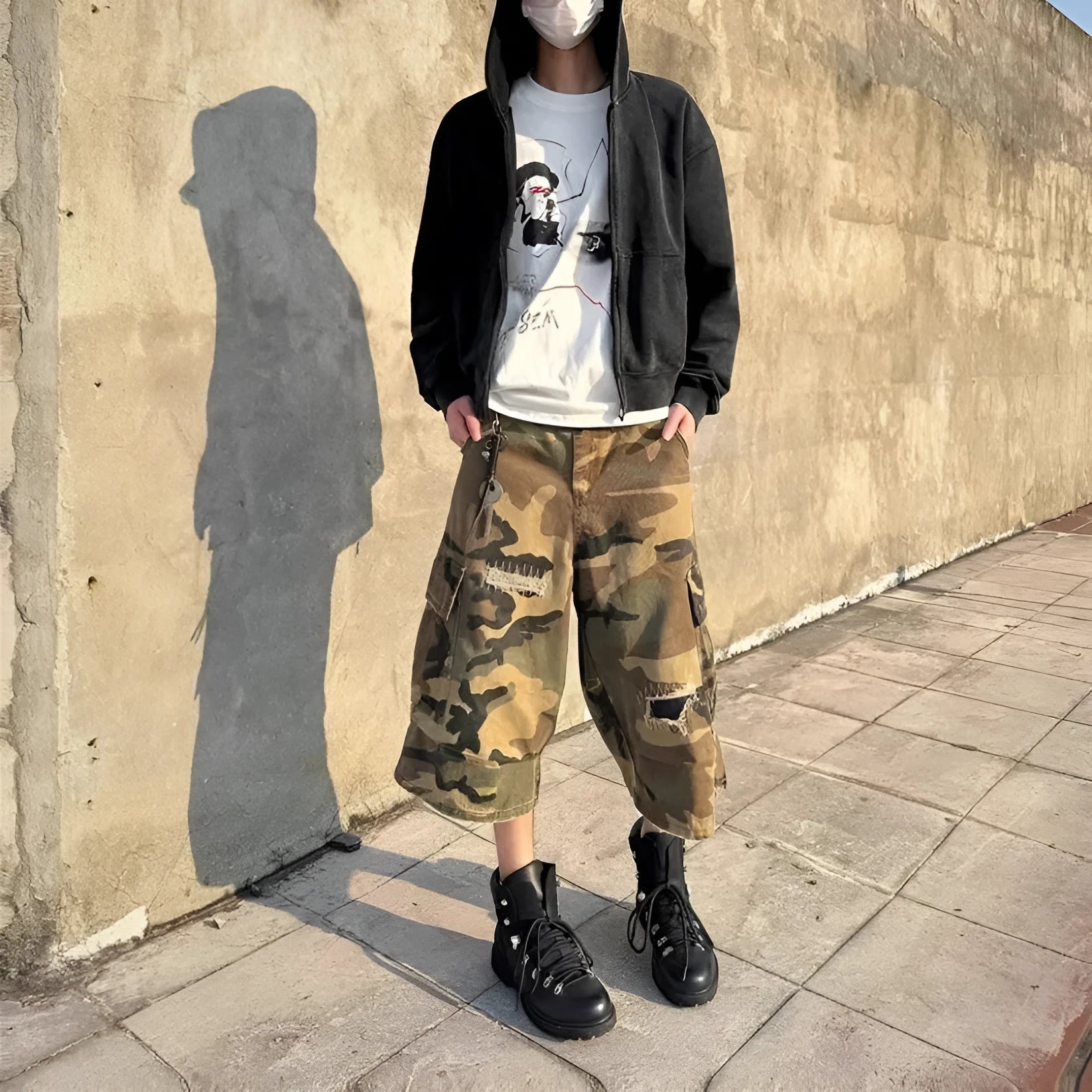 Men's loose straight leg jeans in camouflage colour with ripped patch details and a cropped ankle length