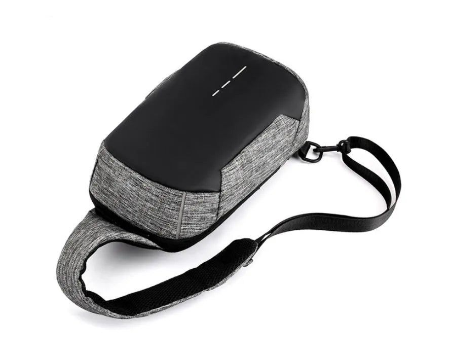 Small dark blue Oxford cloth chest bag with zipper closure showing internal phone compartment