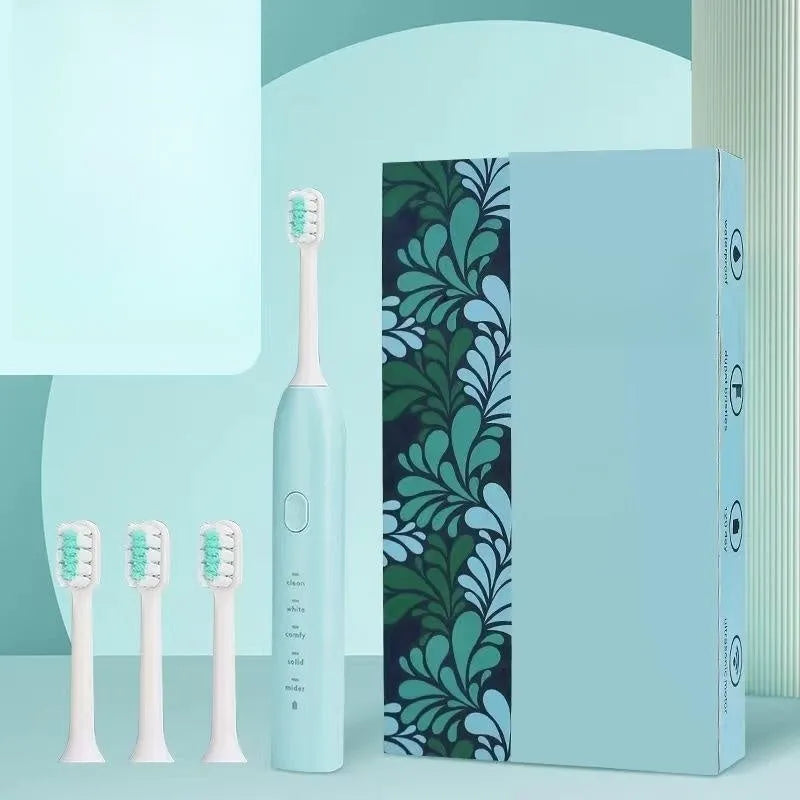 Small Yellow Duck rechargeable electric toothbrush in yellow, showing soft bristle head and USB port.