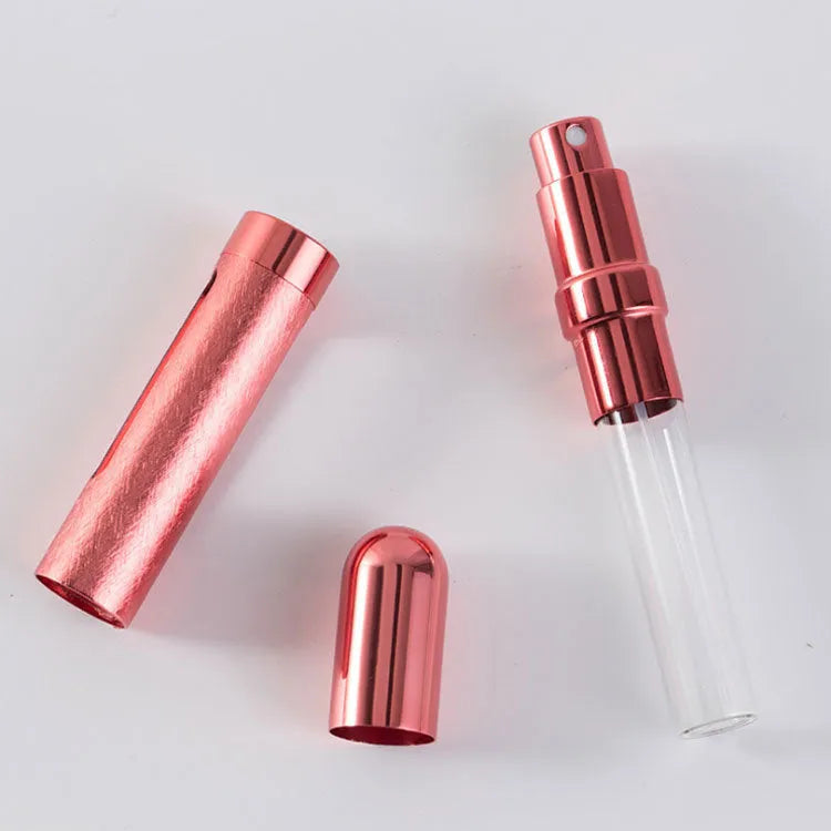 A slim, portable 12ml aluminium perfume bottle with a glass liner in choice of colours including blue, golden, pink, red, silvery, and violet.