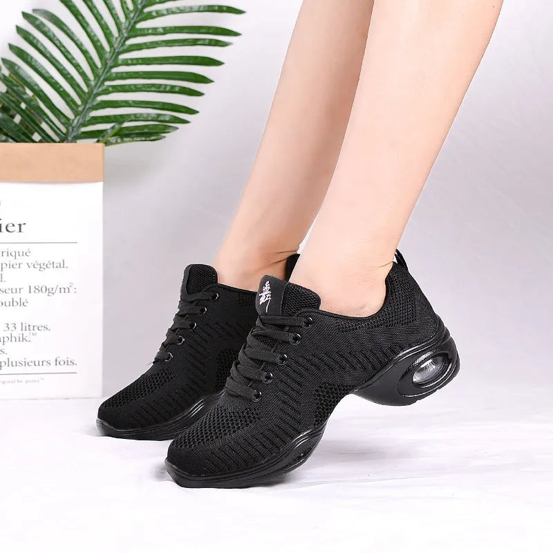 Women's white breathable fly woven mesh dance shoes with a soft PU sole on a light background.