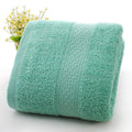 Thickened 800 gsm cotton bath and beach towel shown in apple green colour
