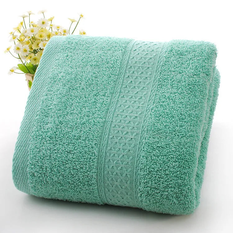 Thickened 800 gsm cotton bath and beach towel shown in apple green colour