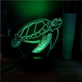 3D acrylic turtle-shaped LED night light displaying one of its 16 colour options.