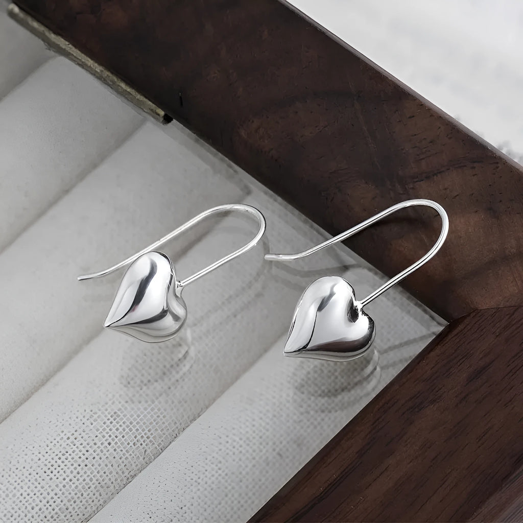 Three-dimensional glossy heart-shaped earrings with Korean style design and silver colour finish