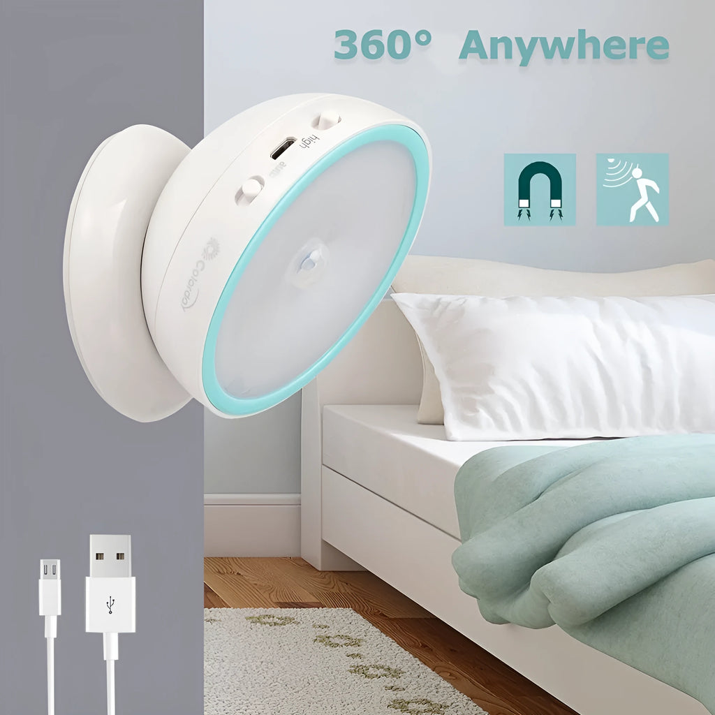 White 360-degree rotating LED human body induction night light with motion sensor, 8.6cm diameter, on a flat surface