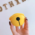 Yellow silicone AirPods case with decorative bell charm for wireless earbuds protection