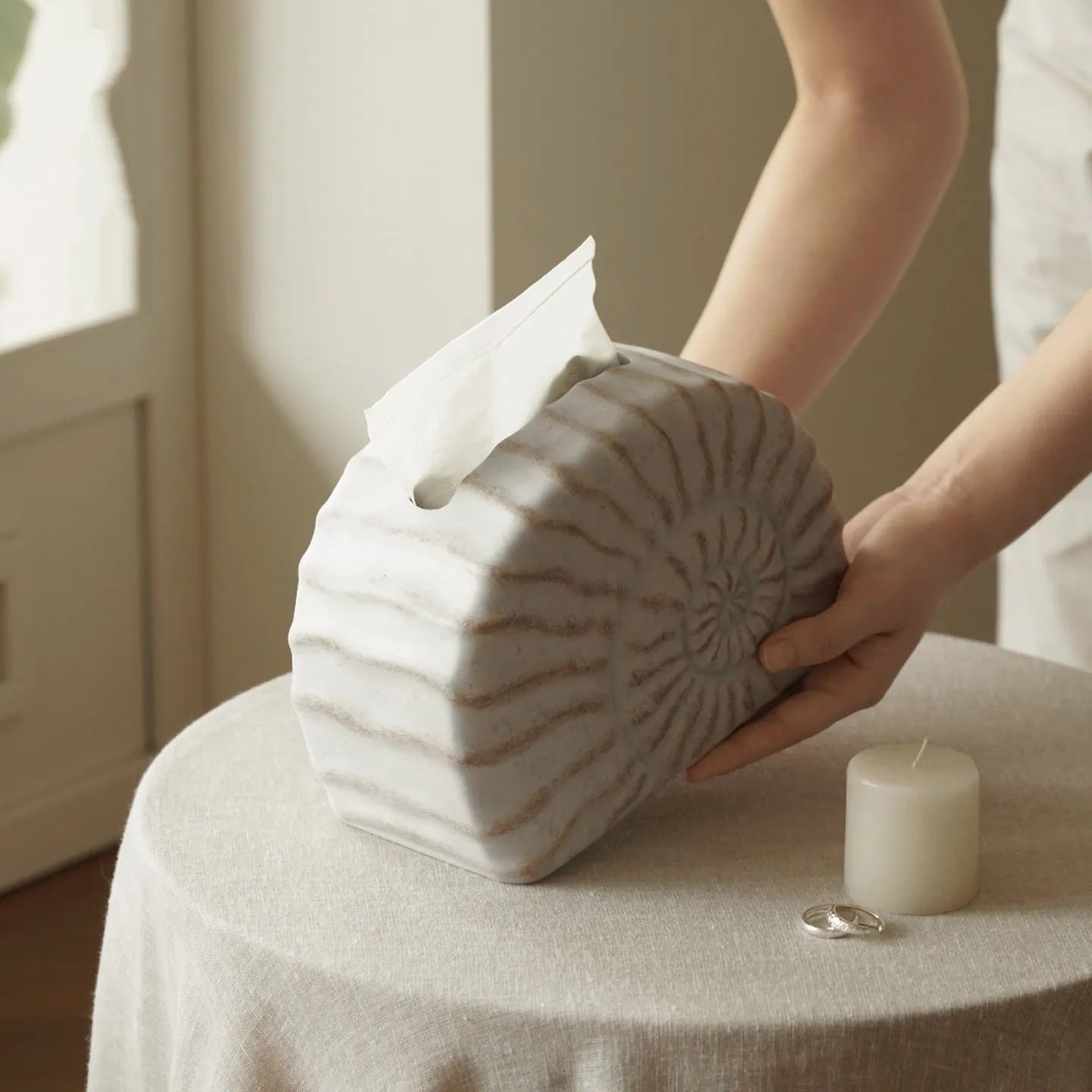 Resin conch shell tissue box decoration in conch ramble colour on wooden table