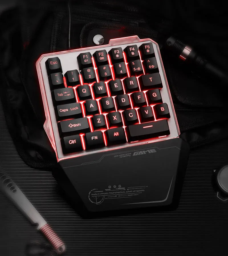 Black robotic one-handed mechanical keyboard with RGB backlit keys on a G40 flow colour plate.