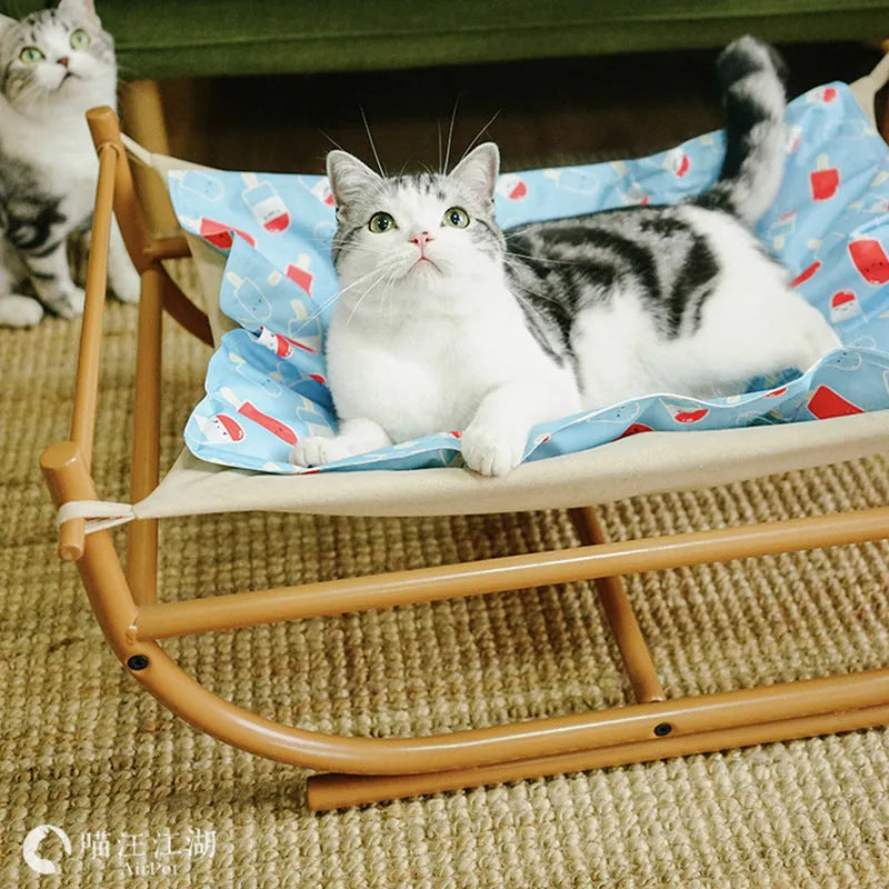 Iron cat hammock pet sofa bed in milk tea colour on a white background, semicircle design