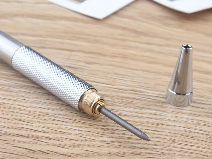 A metal mechanical pencil for drafting and writing with multiple lead size options.