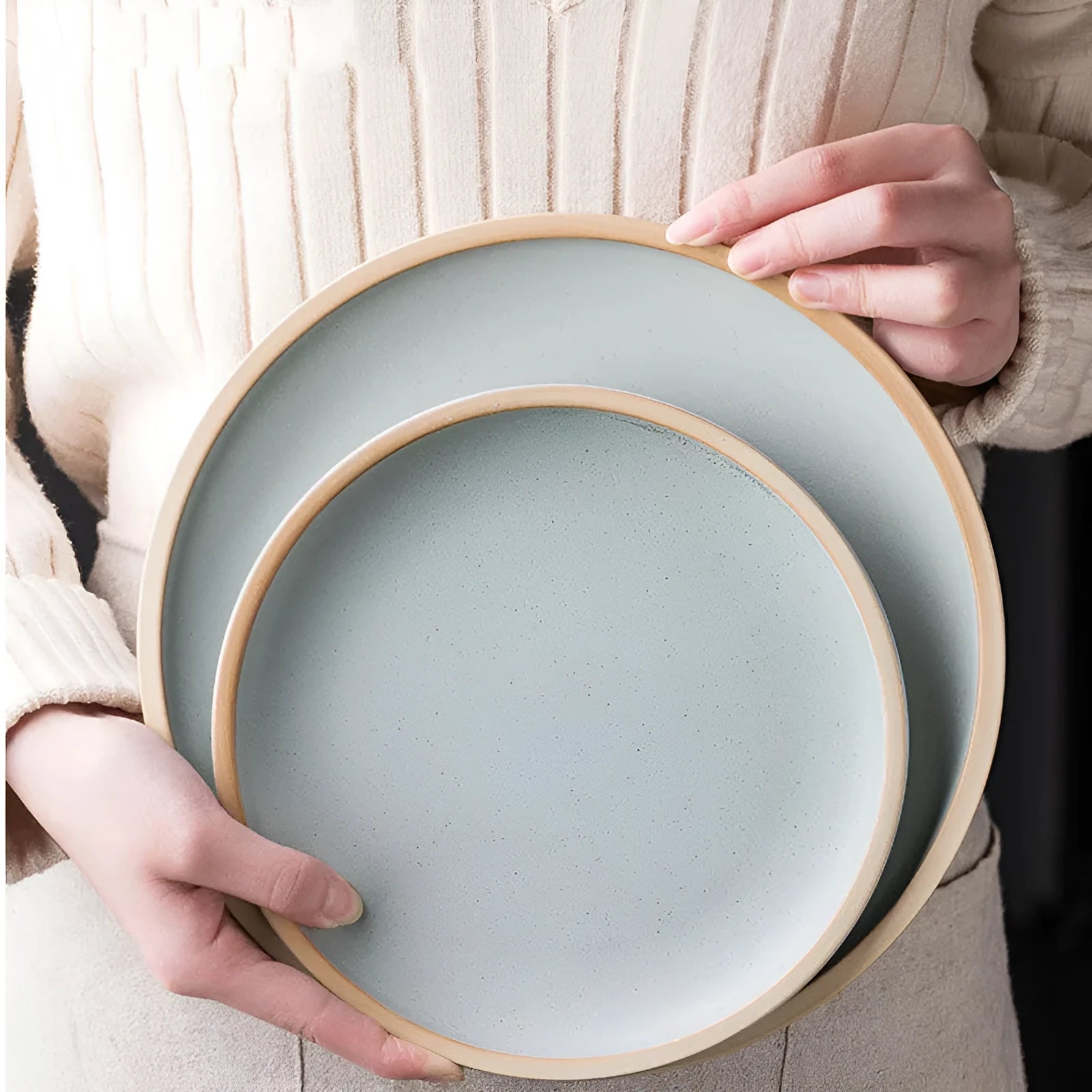 Blue matte ceramic dinner plate 10 inches with sesame point glaze on a table