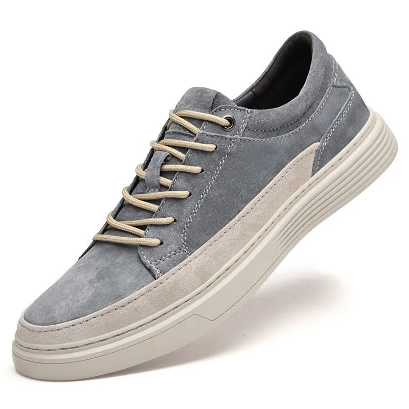 Men's grey pigskin leather casual skate shoes with flat rubber sole and lace-up front.